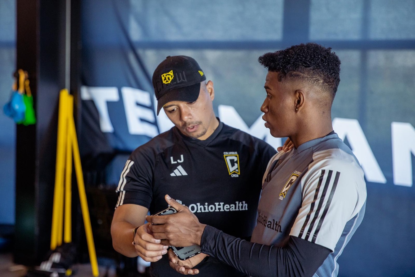 Luis Jeronimo reviewing training information with a player